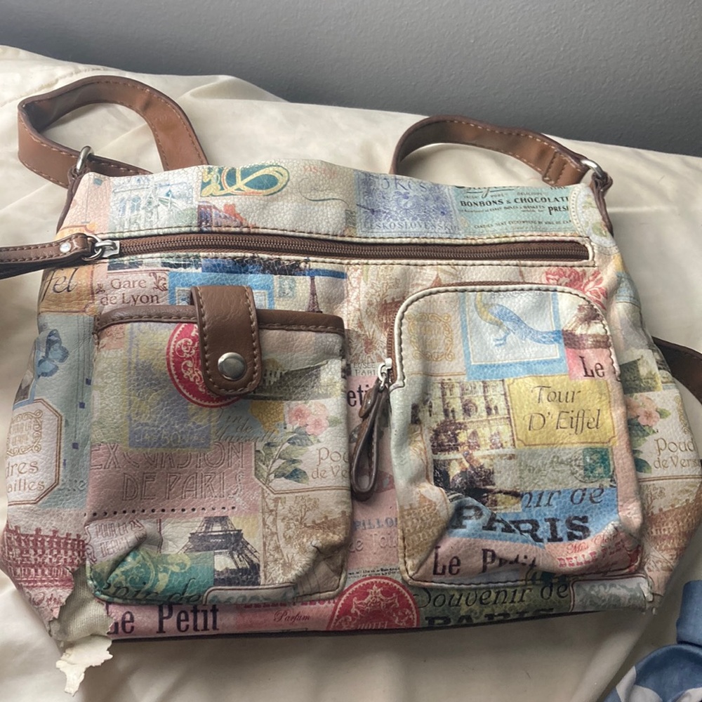 It’s a really cute purse, brown with every different color on it,